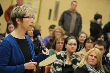 Peggy Thompson speaks at a meeting  about the public board reviewing several area schools. (Photo by Jason Viau)