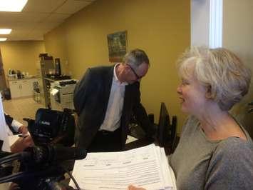Philippa Von Ziegenweidt with the group Citizens for an Accountable Mega hospital Planning Process submits a petition to Windsor West MPP Lisa Gretzky's office on April 15, 2016. (Photo by Ricardo Veneza)