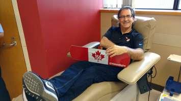Windsor West MP Brian Masse relaxes after donating blood at a Canada 150 donor clinic in Windsor on June 29, 2017 (Photo by Mark Brown/Blackburn News)