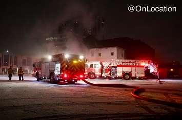 Fire crews on scene of a building fire in downtown Windsor on Saturday, January 1, 2022. (Photo courtesy of @OnLocation via Twitter)
