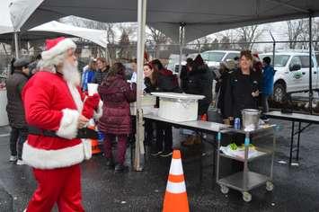 Santa Claus is among those spreading holiday cheer at ReMax's 4th annual Turkey Giveaway in Windsor, December 20, 2018. Photo by Mark Brown/Blackburn News.