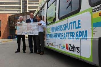 Windsor Mayor Drew Dilkens (middle) accepts a cheque for $15,000 from Zehrs, in order to pay for Transit Windsor shuttle service on the night of fireworks on the riverfront, June 13, 2017. (Photo by Mike Vlasveld)