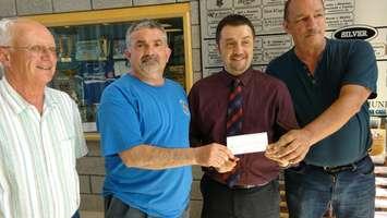From left, Kingsville deputy mayor Gord Queen, Ted Rocheleau, grand knight of the Kingsville Knights of Columbus and Kingsville Mayor Nelson Santos at a cheque presentation at Kingsville Recreational Complex, May 18, 2017.  Photo by Mark Brown/Blackburn News.