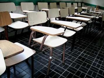 File photo of school desks courtesy of Alvimann via morgueFile