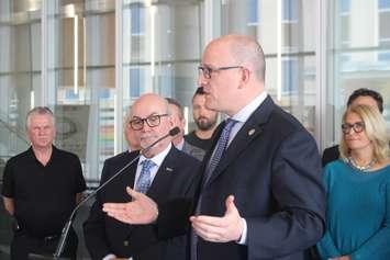 Windsor Mayor Drew Dilkens makes a point as Essex County Warden Gary McNamara and area representatives in labour and business look on at City Hall, May 17, 2019. Photo by Mark Brown/Blackburn News.