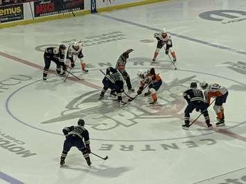 The opening faceoff between the Windsor Spitfires and Flint Firebirds at the WFCU Centre, January 8, 2023. Photo by Mark Brown/WindsorNewsToday.ca.