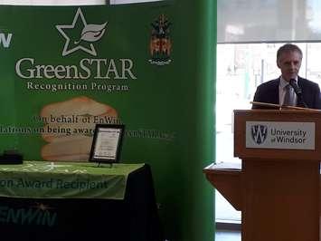 University of Windsor president Dr. Alan Wildeman accepts a GreenSTAR conservation award from EnWin Utilities at the U of W Welcome Centre on April 19, 2018. Photo by Mark Brown, Blackburn News