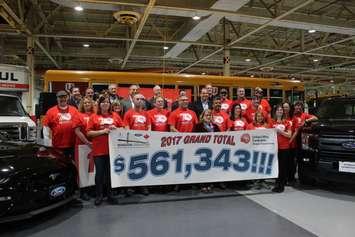 Ford employee reveal their total donation to the United Way campaign, February 15, 2018. (Photo by Maureen Revait) 