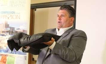 Windsor Regional Hospital CEO David Musyj demonstrates  the Quick Dam product they've purchased for flood protection., September 8, 2017. (Photo by Maureen Revait) 