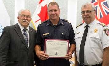 Essex Fire and Rescue Services Captain Joe Meloche receiving an award from Essex Mayor Ron McDermott June 18, 2018.  (Photo courtesy of the Town of Essex)