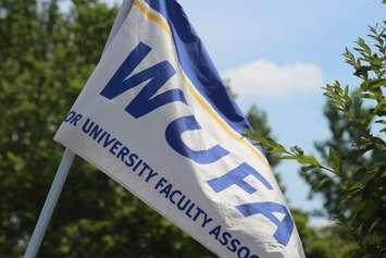 The Windsor University Faculty Association flag is seen at a rally at the Civic Centre in Essex on July 7, 2016. (Photo by Ricardo Veneza)