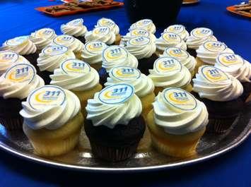 Cupcakes are laid out at a news conference, celebrating the 311 call centre's
10-year anniversary, August 27, 2015. (Photo by Mike Vlasveld)
