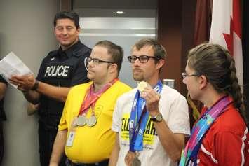 Windsor Police Const. Adam Young and Special Athletes John Kukucka, Dan Morton and Celine Labrecque promote the Yellowcard campaign at Windsor Police Headquarters, October 8, 2015. (Photo by Mike Vlasveld)