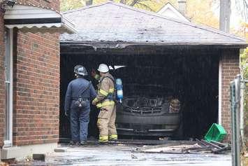 Windsor police and Windsor fire investigate suspicious blaze on Louis Ave. Oct. 31 2014. (Photo by Maureen Revait) 