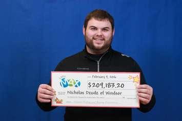 Nicholas Dzudz of Windsor shows off his LOTTO MAX winnings. (Photo provided by OLG )