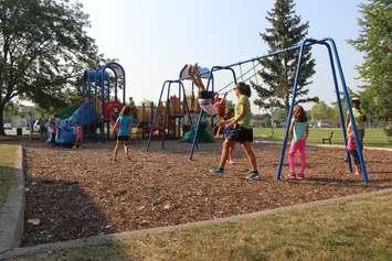 Kids play outside of the Forest Glade Community Centre in Windsor, September 1, 2015. (Photo by Mike Vlasveld)