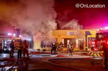 Firefighters on scene of a commercial fire in the 1100 block of Erie Street East in Windsor, Ontario.  (Photo courtesy of @OnLocation via Twitter)