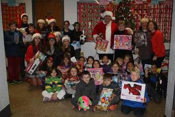 Students from  St. Rose and Corpus Christi schools helped collect toys for those in need. (Photo courtesy Rosemary Barbera)
