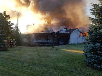 A house burns on Road 7-E in Kingsville, July 8, 2018. Photo provided by Kingsville Fire/Twitter.