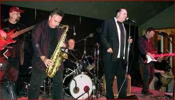 Kim Kelly on saxophone with the Downchild Blues Band.  (Photo from Kim Kelly's Facebook page)