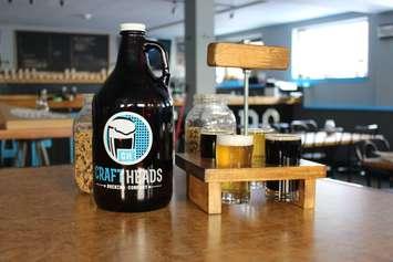 Craft Heads growler and flight, February 2015. (Photo by Mike Vlasveld)