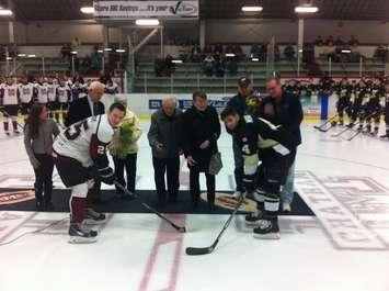 George Aitken drops the puck at Chatham Memorial Arena in a pre-game induction ceremony for the Faces of the Maroons Wall of Fame. (Photo by Mike James.)