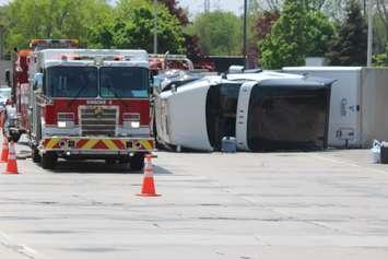 Windsor Fire and Rescue on scene of an overturned transport truck at the Ambassador Bridge on-ramp, Windsor, May 17, 2018. Photo by Mark Brown/Blackburn News.
