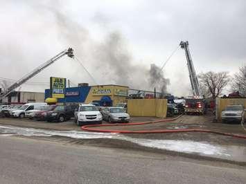 Windsor fire crews work on a blaze at J & B Auto Parts on Provincial Rd., March 9, 2017. (Photo by Maureen Revait)