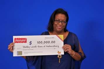 Shelley Lovell-Rees of Amherstburg shows off her $100,000 cheque at the OLG Prize Centre in Toronto, January 16, 2020. Photo provided by Ontario Lottery and Gaming.