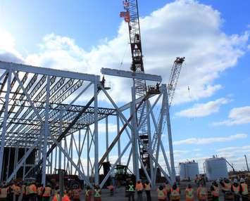 NextStar Energy holds a “Topping Out” ceremony with local trade employees to celebrate the last structural steel beam installed in the construction of its new EV battery plant in Windsor, Ontario.  (Provided by Stellantis North America)