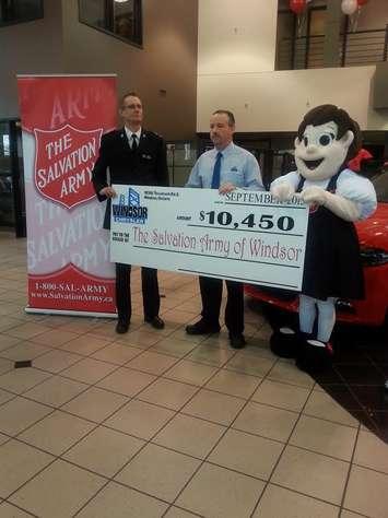 Windsor Chrysler donates the proceeds of its Drive For Windsor campaign to the Salvation Army, October 6, 2015. (Photo by Arlene Sinasac)