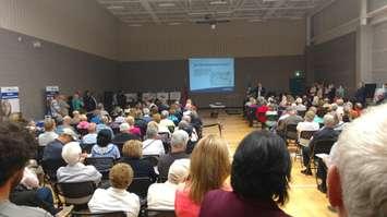 A packed South Windsor Recreation Centre gym listens as Mayor Drew Dilkens provides a flooding update during a Ward 1 meeting on September 12, 2017. Photo by Mark Brown/Blackburn News.