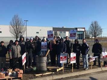 Members of Unifor Local 444 picket outside Dakkota Integrated Systems on March 4, 2018. Photo courtesy of Unifor Local 444/Facebook.