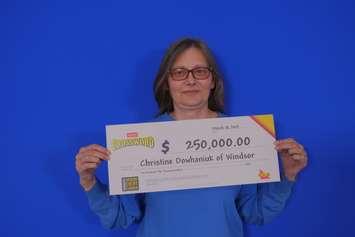 Christine Dowhaniuk of Windsor shows off her $250,000 cheque at the OLG Prize Centre in Toronto. Photo provided by OLG.