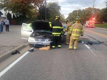 Firefighters extricate the driver of a vehicle involved in a head-on crash on Front Rd. in Amherstburg, October 25, 2016. (Contributed Photo)