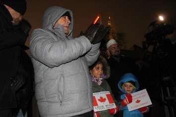 A man and children participate in Windsor's vigil following the attack on a Quebec City mosque, January 31, 2017.  (Photo by Maureen Revait)