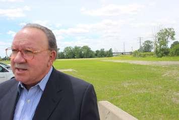 WECDSB Trustee Fulvio Valentinis shows media the land on McDougall Street being purchased for a new Catholic Central High School, June 14, 2019. Photo by Mark Brown/Blackburn News.