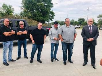 Unifor Local 200 president John D'Agnolo, third from right, Local 444 president Dave Cassidy, second right, and Windsor Mayor Drew Dilkens, far right, join union members outside the Nemak plant in Windsor, September 3, 2019. Photo courtesy Unifor Local 444/Twitter.