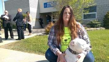 Jenna Postma protests dog-fighting outside the Provincial Offences Courthouse in Chatham-Kent with her dog Clover. May 18, 2016. (Photo by Matt Weverink)