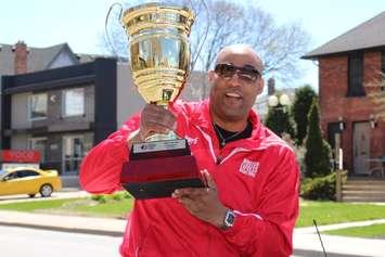 Windsor Express Head Coach Bill Jones with the NBL Canada trophy during the team's championship parade along Ouellette Ave. on April 26, 2014. (Photo by Ricardo Veneza)