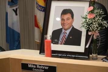 A framed photo of the late Tecumseh councillor Mike Rohrer sits at his spot at the council table on June 28, 2016. (Photo by Ricardo Veneza)