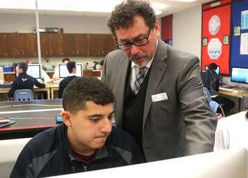 Rocky Ieraci working with one of his students at Holy Names Catholic High School in Windsor.
(Photo courtesy of Stephen Fields/Windsor-Essex Catholic District School Board)