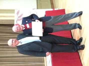 Wayne Gladstone (right) Canadian Blood Services board member with George Sims (Chatham) who reached 100 donations in 2014 (Photo courtesy of Chris McCleod)