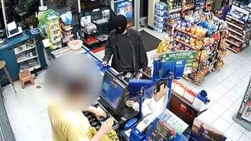 Police are looking for a suspect following two convenience store robberies in Windsor. (Photo courtesy of the Windsor Police Service via YouTube)