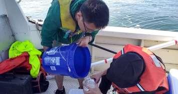 Researchers take samples from Lake Erie. (Photo courtesy of @ErieWatch)