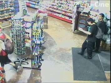 Two suspects wanted in connection with a robbery and assault at Q-Store on Dougall Ave., July 10, 2015. (Photo courtesy Windsor police)