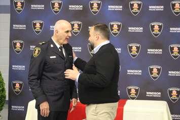 Windsor Police Chief Al Frederick is greeted by City Councillor and police board member Rino Bortolin during Fredericks retirement open house, June 18, 2019. Photo by Mark Brown/Blackburn News.