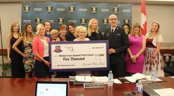 Charity Chix and Windsor police service present checks to charities, June 22, 2017. (Photo by Maureen Revait) 