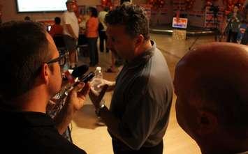 Unifor Local 444 President Dino Chiodo speaks to the media at Taras Natyshak's election victory party, June 12, 2014. (photo by Mike Vlasveld)