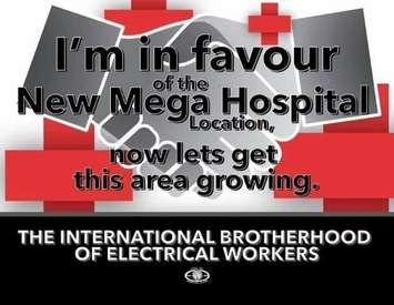 Sign being distributed by the International Brotherhood of Electrical Workers. (Courtesy of Karl Lovett)